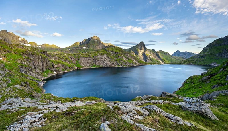 Mountain landscape with lake Tennesvatnet, at sunrise, in the back peak of Hermannsdalstinden, Moskenesoya, Lofoten, Nordland, Norway, Europe