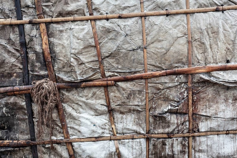 Detail of a makeshift dwelling made of plastic sheeting and bamboo sticks, Tejgaon Slum Area, Dhaka, Bangladesh, Asia