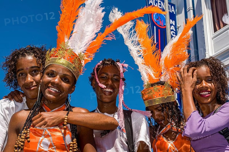 Costumed people celebrating Carnival. Mindelo. Cabo Verde. Africa