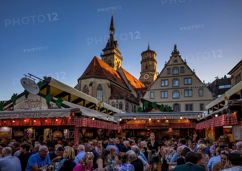 People sitting in wine arbours in the evening, Weindorf Stuttgart, Schillerplatz, collegiate church, Fruchtkasten, blue hour, Stuttgart, Baden-Württemberg, Germany, Europe