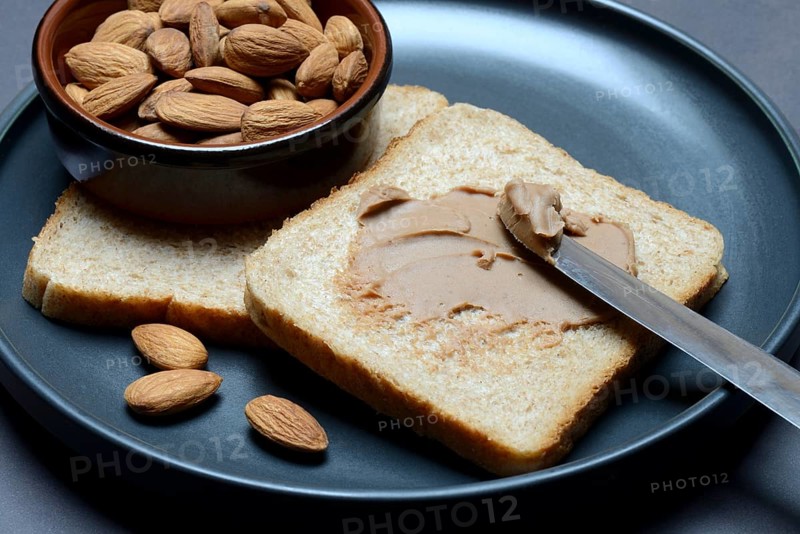 Toast with almond cream and almond shell, spread
