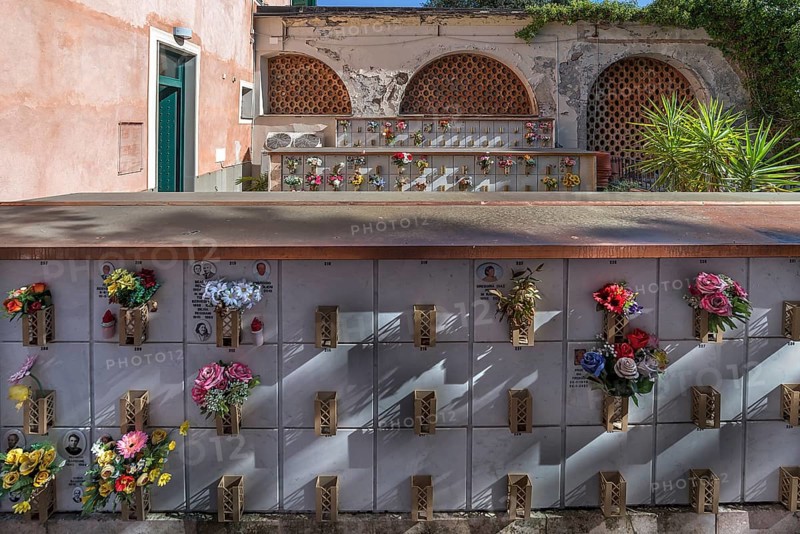 Flower-decorated urn graves in an inner courtyard, Monumental Cemetery, Cimitero monumentale di Staglieno), Genoa, Italy, Europe
