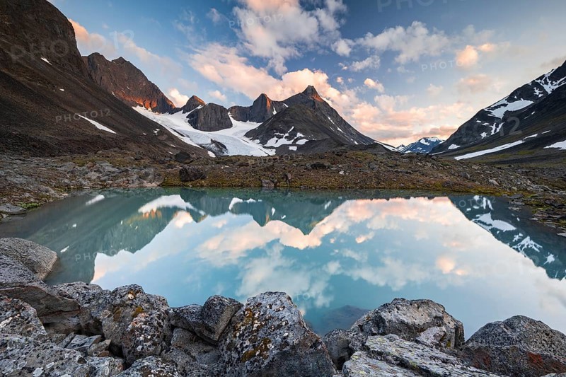 Kaskapakte glacier reflected in glacial lake, Kaskasatjakka mountain and Kuopertjakka, Kaskasavagge valley, Kebnekaise massif, Lapland, Sweden, Europe