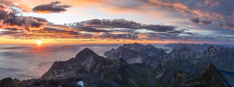 Panorama, view over mountain tops and sea, dramatic sunset, from the top of Hermannsdalstinden, Moskenesöy, Lofoten, Nordland, Norway, Europe