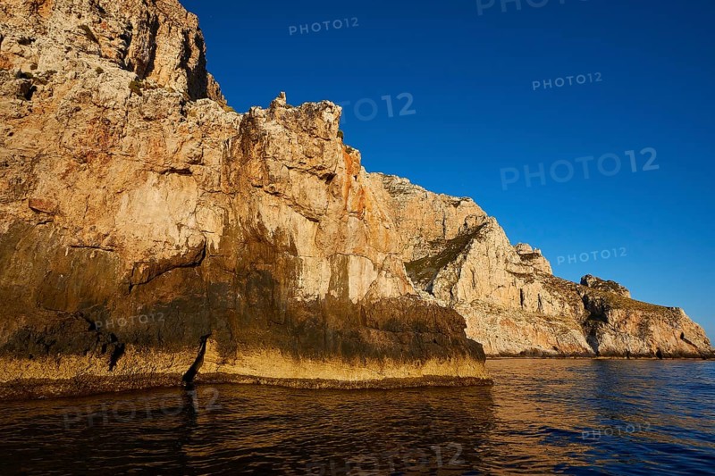 Evening light, Boat tour, View from the sea, Bizarre rock formations, Rugged mountains, Marettimo, Egadi Islands, Sicily, Italy, Europe