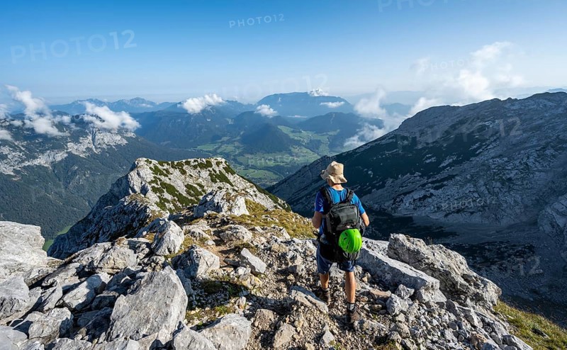 Mountaineer on a rocky path with mountain panorama, mountain tour to the summit of the Hochkalter, Hochkalter crossing, Berchtesgaden Alps, Bavaria, Germany, Europe