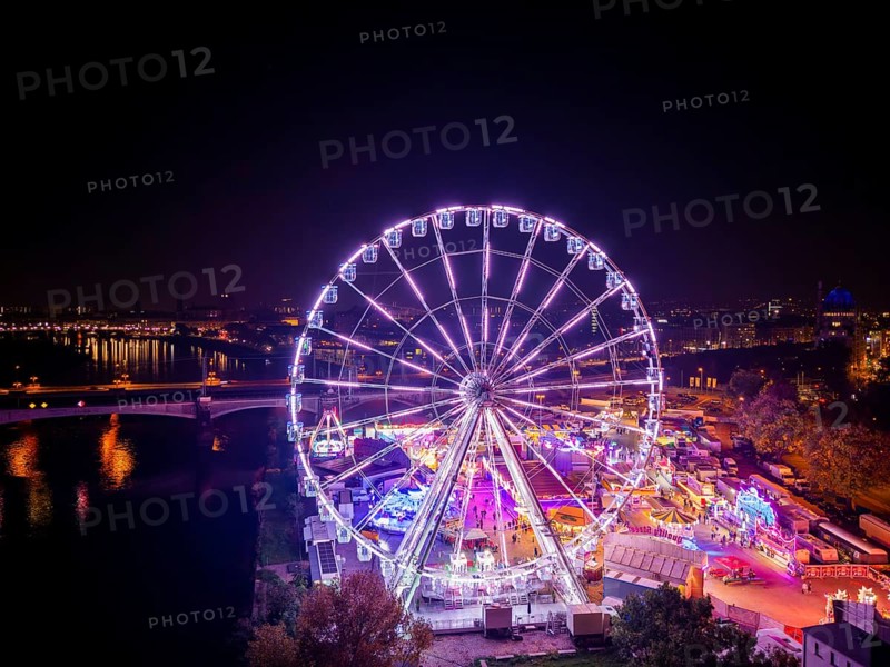 A 55m high illuminated Ferris wheel is the landmark of the fair at the Volksfest grounds on Pieschner Allee in Dresden