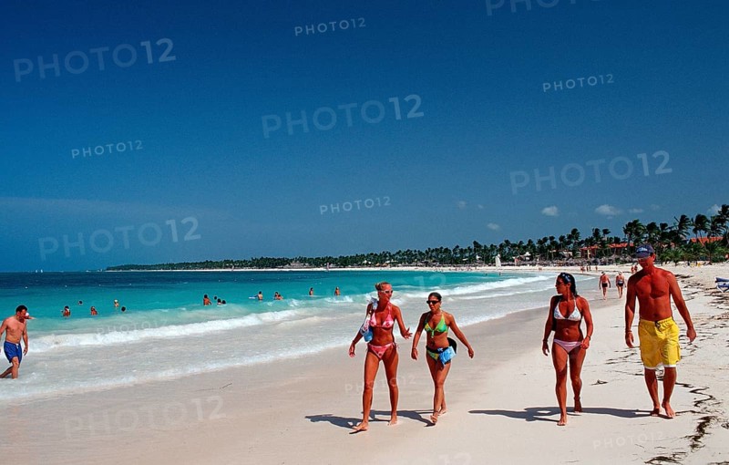 Holidaymakers on a sandy beach, Punta Cana, Caribbean, Dominican Republic, Central America