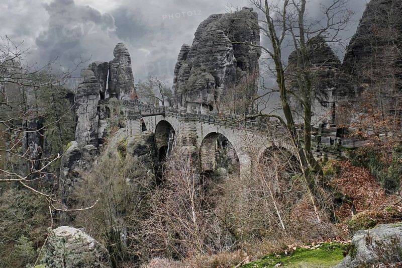 The Bastei Bridge in Saxon Switzerland. jagged rocks, viewing platform overlooking the Elbe. Tourist attraction. Dramatic sky. National park in Germany