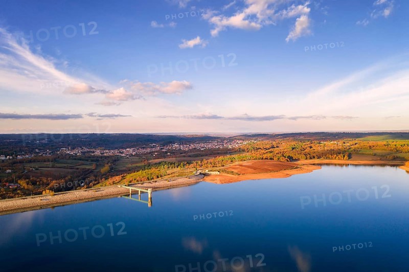 Drone aerial panoramic view of Sabugal Dam lake reservoir with perfect reflection, in Portugal