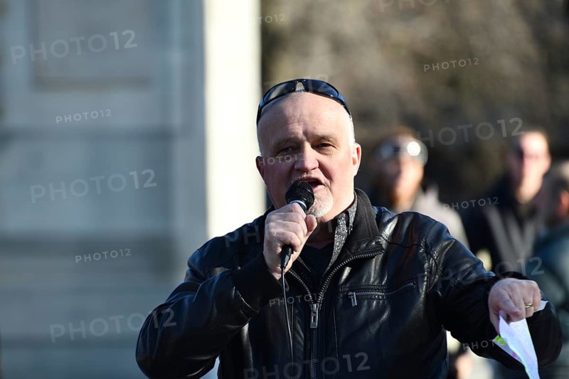 CHRISTCHURCH, NEW ZEALAND, JULY 24, 2021, A man speaks at a protest rally at the Bridge of Remembrance in Christchurch. Activists spoke against increasing government control over Covid vaccinations, farm taxes and civil liberties