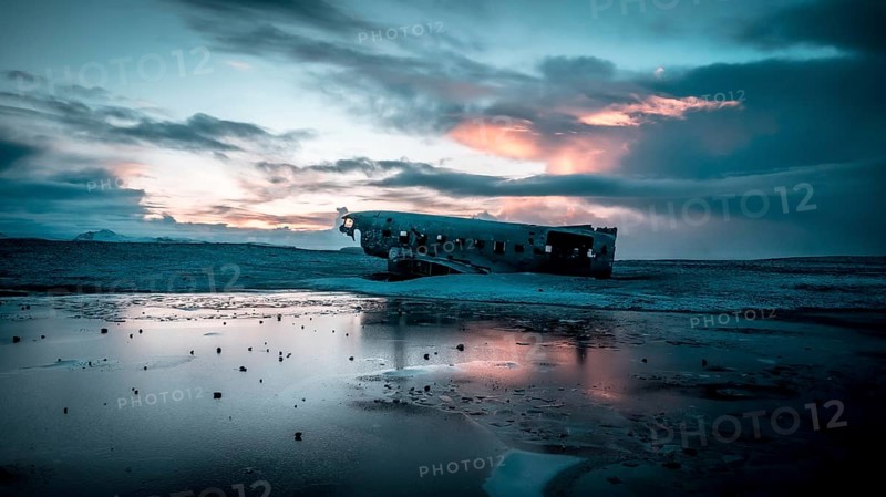 Aerial drone view of crashed plane on frozen Solheimasandur beach in winter, Iceland, Europe