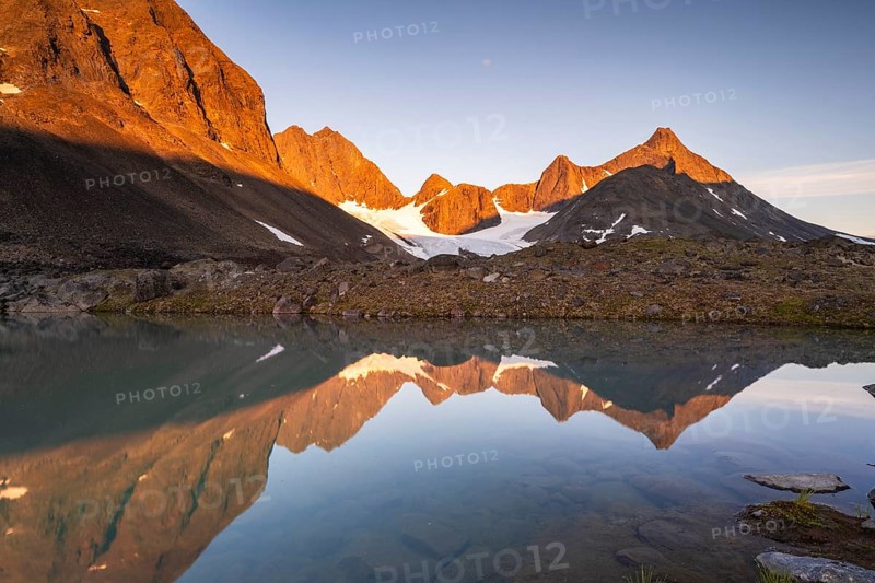 Kaskapakte glacier reflected in glacial lake, Kaskasatjakka mountain and Kuopertjakka, Kaskasavagge valley, Kebnekaise massif, Lapland, Sweden, Europe