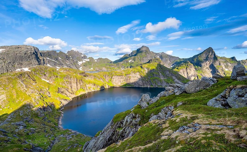 Mountain landscape with lake Tennesvatnet, at sunrise, in the back peak of Hermannsdalstinden, Moskenesoya, Lofoten, Nordland, Norway, Europe