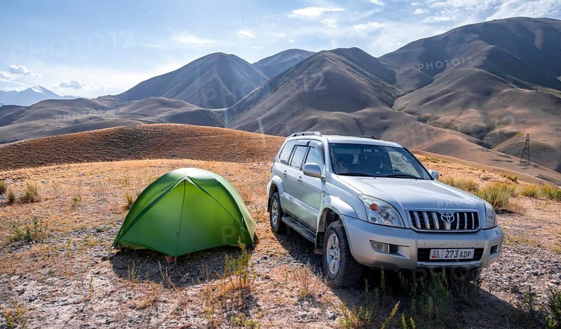 Toyota Landcruiser and tent on a hill, Chuy province, Kyrgyzstan, Asia