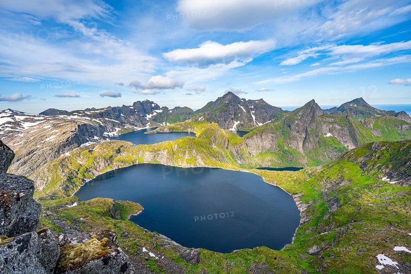 Mountain landscape with steep rocky peaks and lake Tennesvatnet and Krokvatnet, in the back peak of Hermannsdalstinden, view from the top of Munken, Moskenesoya, Lofoten, Nordland, Norway, Europe