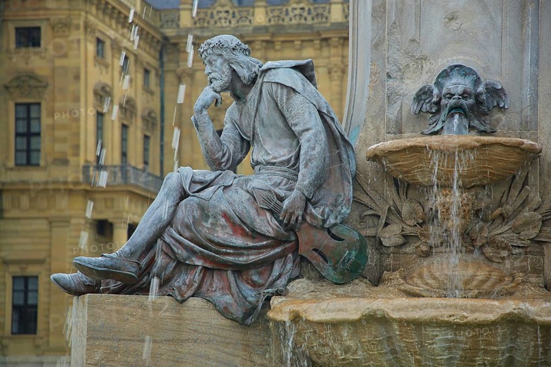Sculpture of medieval lyricist and poet Walther von der Vogelweide, Frankoniabrunnen built 1894, water drop, motion blur, blur, water jet, water splash, figure, stone, Residenzplatz, Würzburg, Lower Franconia, Franconia, Bavaria, Germany, Europe