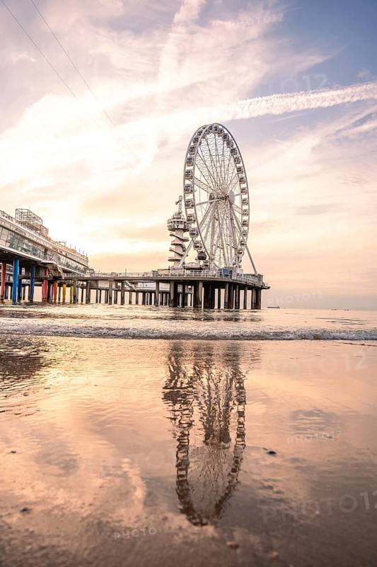 Ferris wheel on the pier on the beach at sunset, The Hague, Netherlands