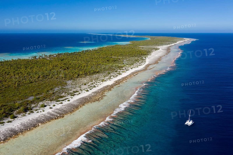 Catamaran off Apataki Atoll, Tuamotu Archipelago, French Polynesia, Oceania