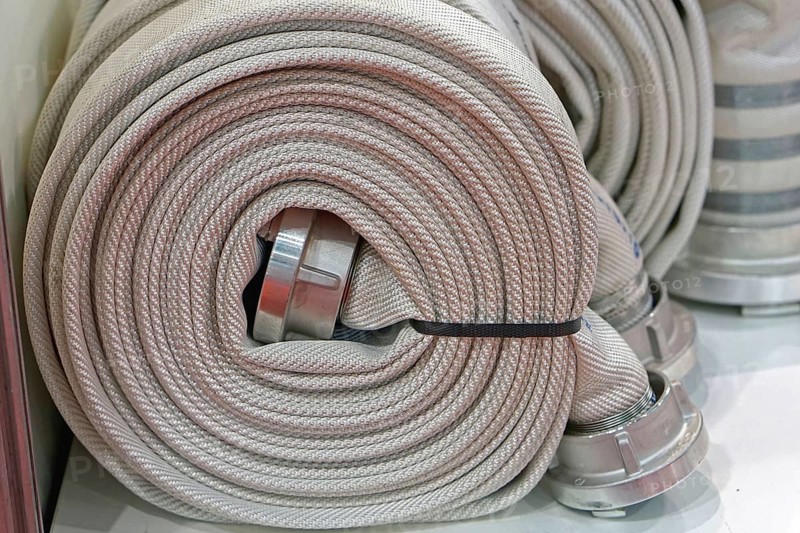 High pressure fire hose in coil