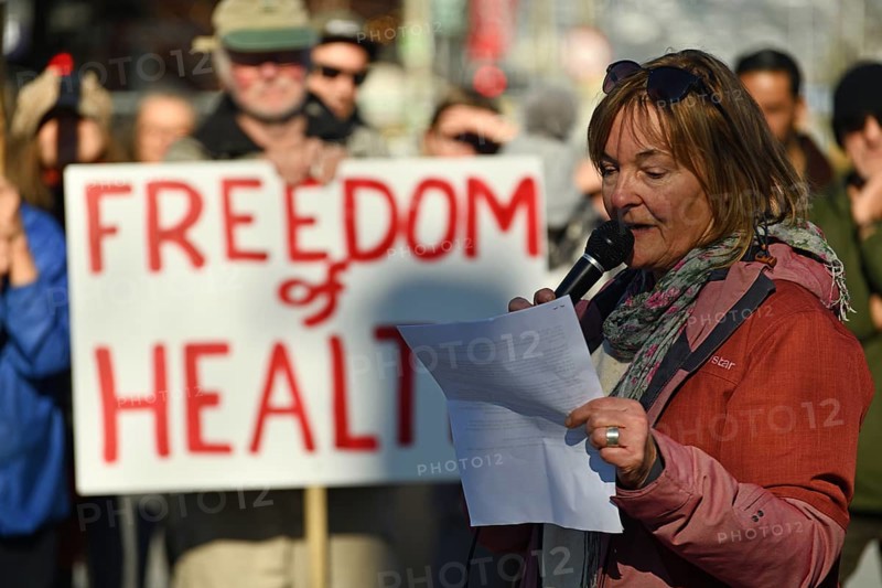 CHRISTCHURCH, NEW ZEALAND, JULY 24, 2021, A woman speaks at a protest rally at the Bridge of Remembrance in Christchurch. Activists spoke against increasing government control over Covid vaccinations, farm taxes and civil liberties