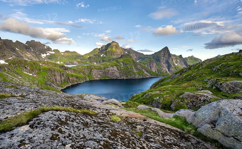 Mountain landscape with lake Tennesvatnet, at sunrise, in the back peak of Hermannsdalstinden, Moskenesoya, Lofoten, Nordland, Norway, Europe