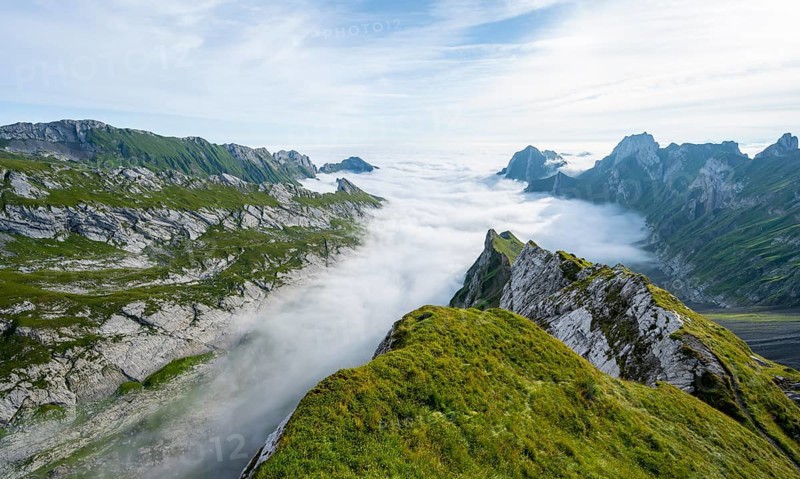 View of mountain peaks above the sea of clouds, Säntis mountains and valley of Meglisalp, high fog, Appenzell Ausserrhoden, Appenzell Alps, Switzerland, Europe