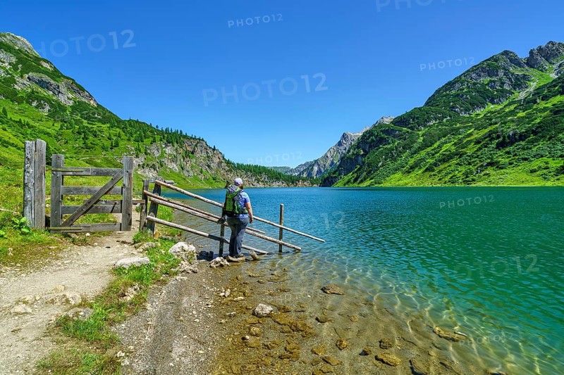 Hiker at Tappenkarsee, mountain lake, Radstätter Tauern, landscape conservation area, Kleinarl, Pongau, Salzburg