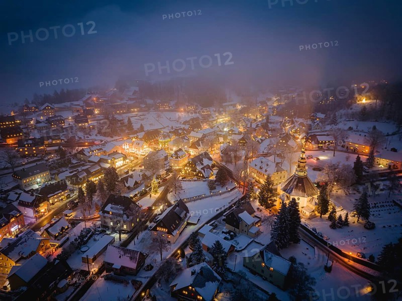 Snow-covered Seiffen with the mountain church