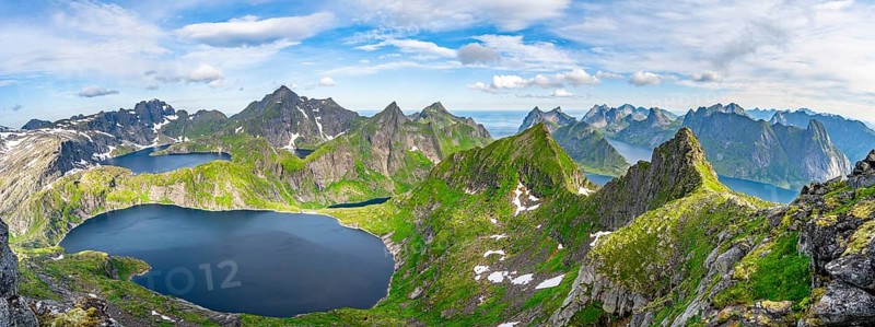 Panorama, mountain landscape with steep rocky peaks and lake Tennesvatnet and Krokvatnet, in the back peak of Hermannsdalstinden, view from the top of Munken to fjords and sea, Moskenesoya, Lofoten, Nordland, Norway, Europe