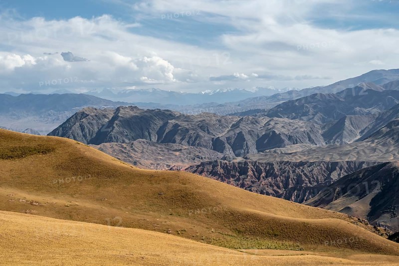 View over eroded mountainous landscape with brown hills, mountains and steppe, Chuy province, Kyrgyzstan, Asia