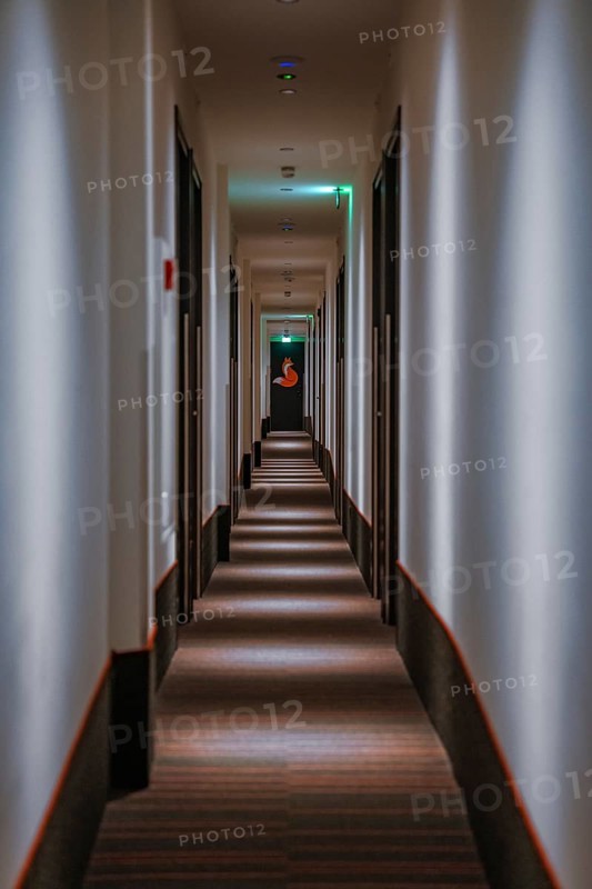 Narrow narrow corridor of a low budget hotel, The Fox, The Hague, Netherlands