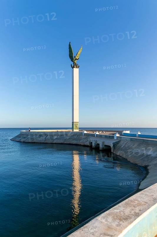 Sculpture of winged Mayan Angel on tall column, the seafront Malecon, Campeche city, Campeche State, Mexico, Central America