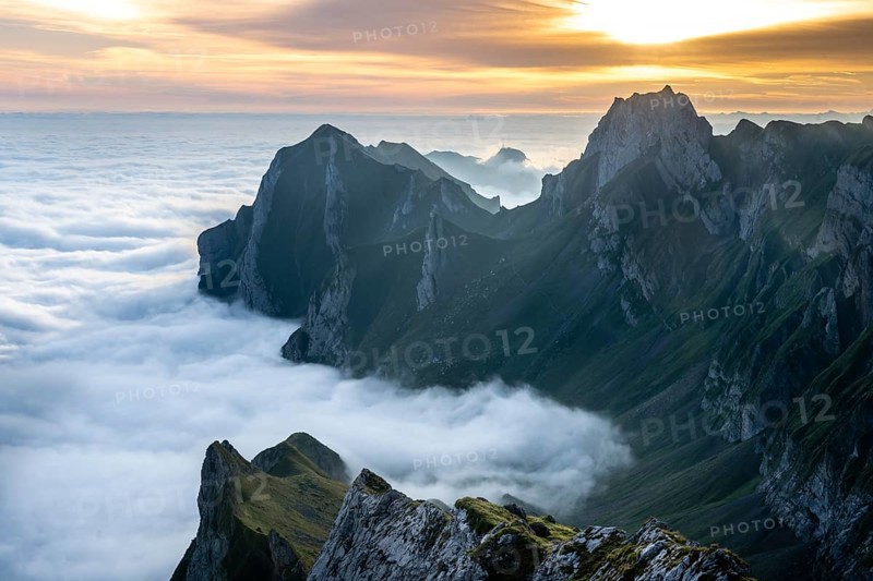 Sunrise over ridge in Alpstein, high fog in valley, Säntis, Appenzell Ausserrhoden, Appenzell Alps, Switzerland, Europe
