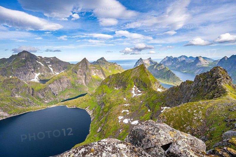 Mountain landscape with steep rocky peaks, lake Tennesvatnet fjords and sea, view from the top of Munken to Reinefjorden, Moskenesoya, Lofoten, Nordland, Norway, Europe