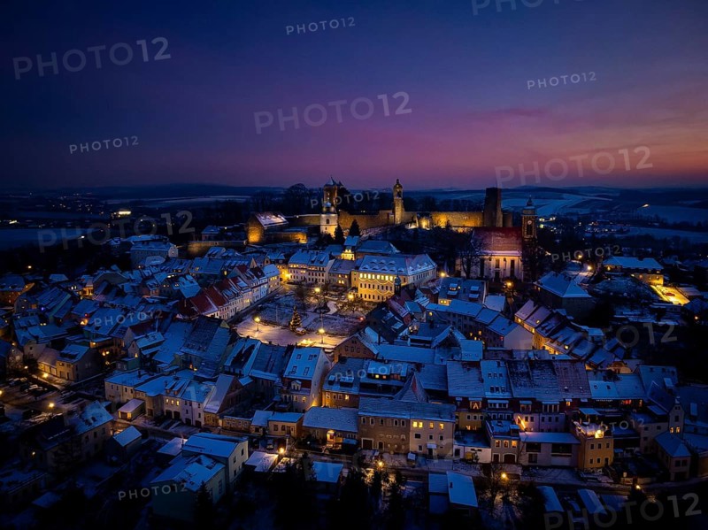 Castle and town of Stolpen on a winter evening