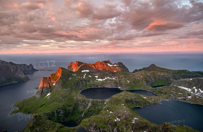 View over mountain peaks and sea, dramatic sunset, from Hermannsdalstinden, with lakes Litlforsvatnet and Tennesvatnet and fjord Forsfjorden, Moskenesöy, Lofoten, Nordland, Norway, Europe