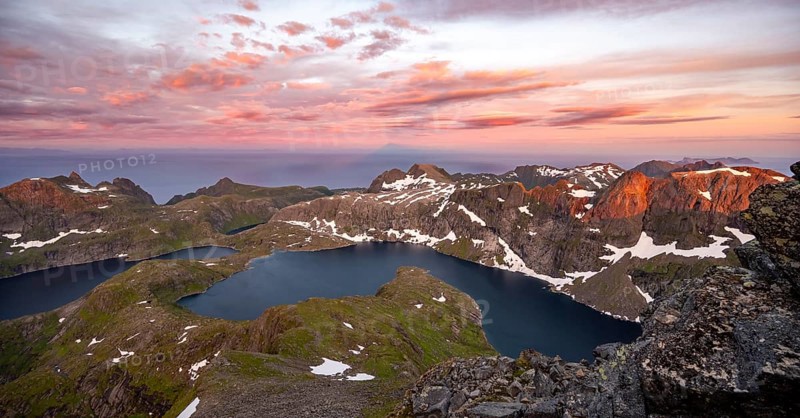 View over mountain top and sea, dramatic sunset, at the summit Hermannsdalstinden, with lakes Tennesvatnet and Krokvatnet, fjord Forsfjorden, Moskenesöy, Lofoten, Nordland, Norway, Europe