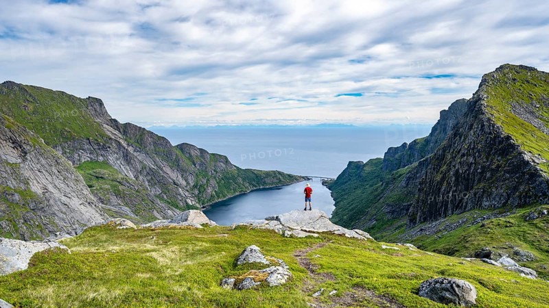 Mountaineers on the hiking trail to Munkebu hut, view of Djupfjorden fjord, Moskenesoya, Lofoten, Nordland, Norway, Europe
