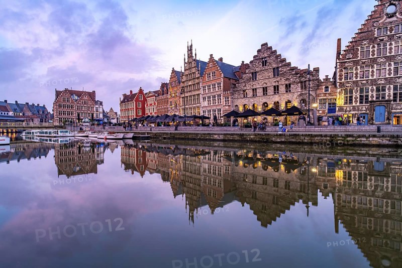 Medieval guild houses of Graslei Kai on the river Leie at dusk, Ghent, Belgium, Europe