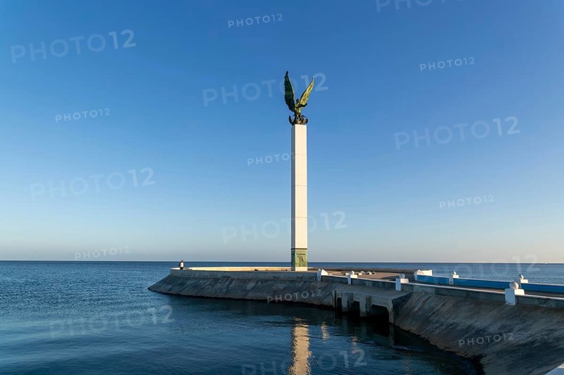 Sculpture of winged Mayan Angel on tall column, the seafront Malecon, Campeche city, Campeche State, Mexico, Central America