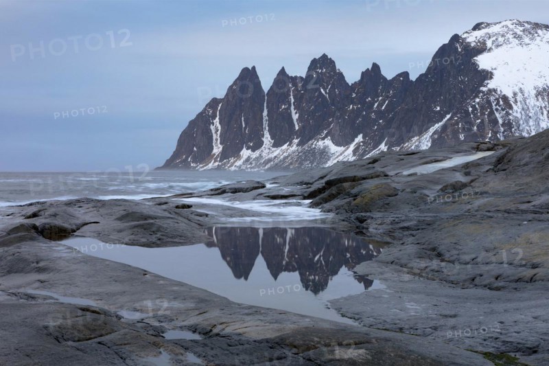 Devil's teeth mountain range (Djevelens tanngard) at Tungeneset rest area, Senja Island, Norway, Europe