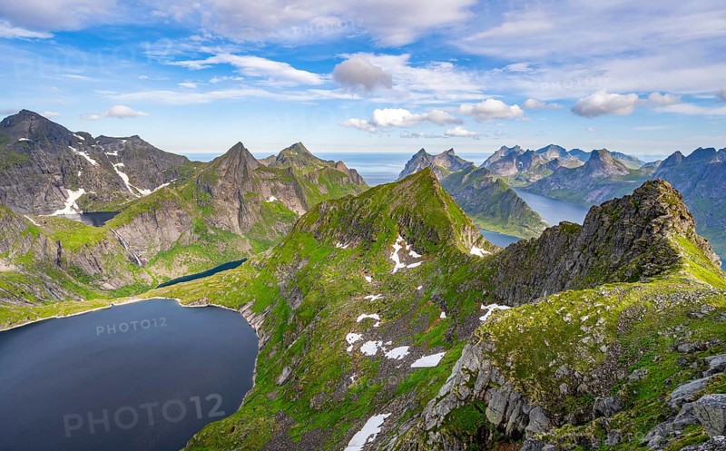 Mountain landscape with steep rocky peaks, lake Tennesvatnet fjords and sea, view from the top of Munken to Reinefjorden, Moskenesoya, Lofoten, Nordland, Norway, Europe
