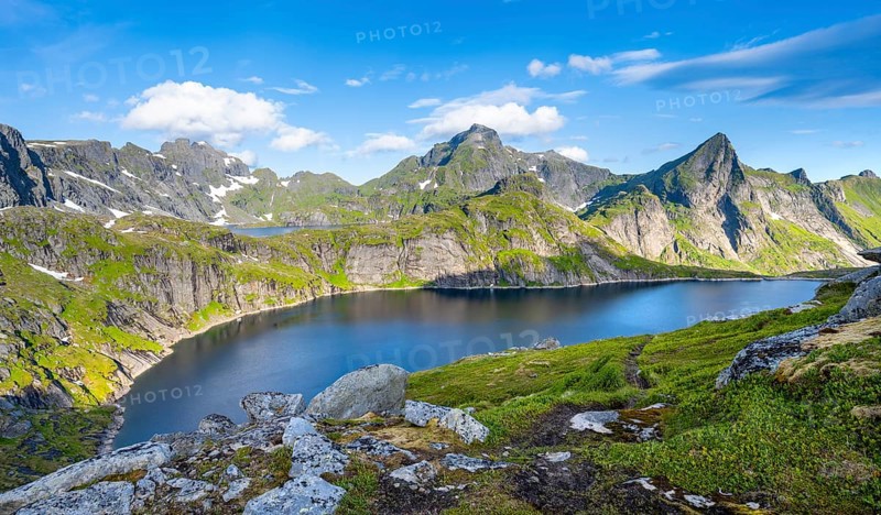 Mountain landscape with lake Tennesvatnet, at sunrise, in the back peak of Hermannsdalstinden, Moskenesoya, Lofoten, Nordland, Norway, Europe