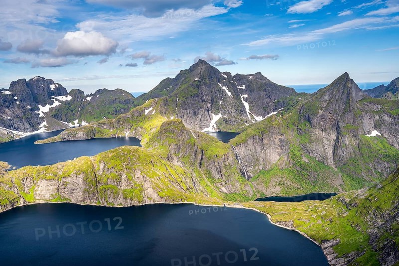 Mountain landscape with steep rocky peaks and lake Tennesvatnet and Krokvatnet, in the back peak of Hermannsdalstinden, view from the top of Munken, Moskenesoya, Lofoten, Nordland, Norway, Europe