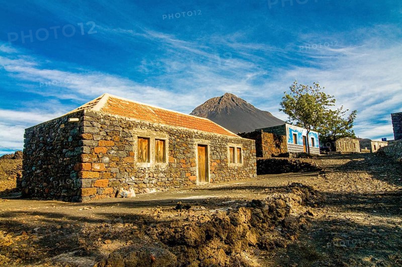Stonehouse with vulcano in background. Fogo. Cabo Verde. Africa