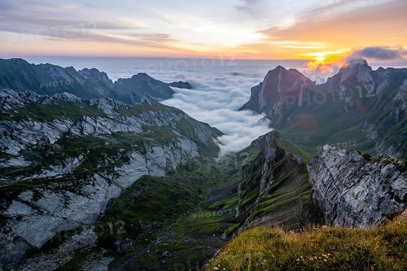 View over Säntis mountains into the valley of Meglisalp at sunrise, high fog in the valley, Säntis, Appenzell Ausserrhoden, Appenzell Alps, Switzerland, Europe