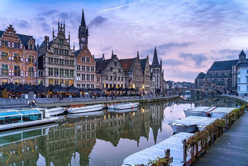 Medieval guild houses of Graslei Kai on the river Leie at dusk, Ghent, Belgium, Europe