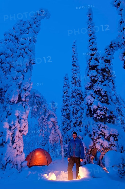 Man with bivouac in the snow, Lapland, Sweden, Europe