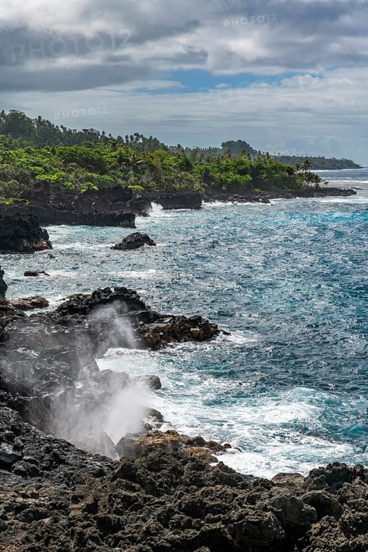 Blow hole on the volcanic south coast of Taveuni, Fiji, South Pacific, Oceania